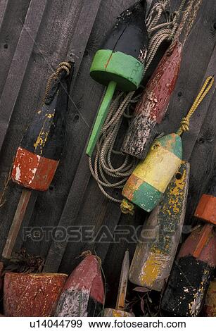 lobster buoys, Maine, Colorful lobster buoys hang on the side of a wooden fishing pier house., View Large Photo Image Stock Photo - lobster buoys, Maine, Colorful lobster buoys hang on the side of a wooden fishing pier house., . Fotosearch