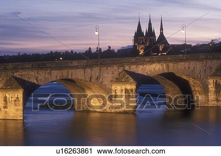 Stock Image -  Loire Valley, France, Blois, Europe, The Pont (bridge) Jacques Gabriel is illuminated at night spanning the Loire River in the medieval town of Blois in the Loire Castle Region of France.. Fotosearch