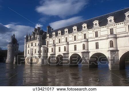 Stock Photo -  Loire Valley, France, castle, Chenonceau, Europe, Scenic view of the 16th Century Chateau de Chenonceau 60-metre-long Galerie, a covered bridge spanning the Cher River in the Loire Castle Region in Chenonceau, France.. Fotosearch