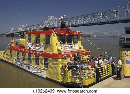 Louisville, riverfront, Ohio River, Kentucky, Yellow water taxi carries passengers across the Ohio River in downtown Louisville in the state of Kentucky. G. R. Memorial Bridge in the background. View Large Photo Image Stock Photo - Louisville, riverfront, Ohio River, Kentucky, Yellow water taxi carries passengers across the Ohio River in downtown Louisville in the state of Kentucky. G. R. Memorial Bridge in the background.. Fotosearch