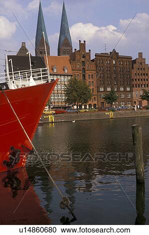 Lubeck, Germany, Europe, Red fire boat moored at a dock on a canal in the Medieval Town of Lubeck. View Large Photo Image Stock Image - Lubeck, Germany, Europe, Red fire boat moored at a dock on a canal in the Medieval Town of Lubeck.. Fotosearch