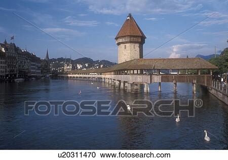 Lucerne, covered bridge, Luzern, Switzerland, Europe, The 14th century covered pedestrian bridge, the Kapellbrucke, on the Reuss in Lucerne is a picturesque landmark in the Canton of Lucerne. The octagonal stone tower alongside is called the Wasserturm ( View Large Photo Image Stock Image - Lucerne, covered bridge, Luzern, Switzerland, Europe, The 14th century covered pedestrian bridge, the Kapellbrucke, on the Reuss in Lucerne is a picturesque landmark in the Canton of Lucerne. The octagonal stone tower alongside is called the Wasserturm (. Fotosearch