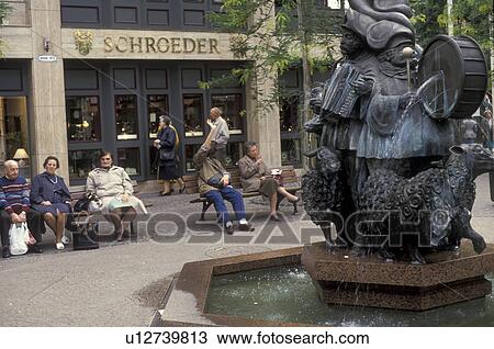 Luxembourg, Luxembourg City, Europe, People resting on benches near a fountain in downtown Luxembourg. View Large Photo Image Stock Image - Luxembourg, Luxembourg City, Europe, People resting on benches near a fountain in downtown Luxembourg.. Fotosearch