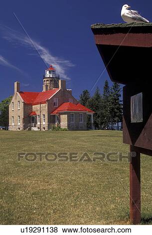 Mackinaw City, lighthouse, Michigan, Scenic view of the 1892 Mackinaw Point Lighthouse with its bright red roof in Mackinaw City in the state of Michigan.  View Large Photo Image Stock Photo -  Mackinaw City, lighthouse, Michigan, Scenic view of the 1892 Mackinaw Point Lighthouse with its bright red roof in Mackinaw City in the state of Michigan. . Fotosearch