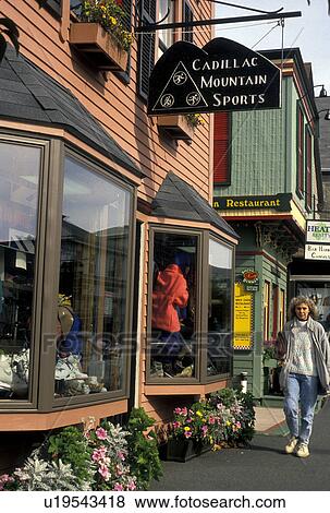 Maine, Bar Harbor, Woman walking past shops along main street in downtown Bar Harbor View Large Photo Image Stock Photo - Maine, Bar Harbor, Woman walking past shops along main street in downtown Bar Harbor . Fotosearch