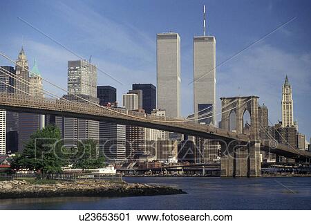 Stock Image -  Manhattan, New York City, Brooklyn Bridge, skyline, N. Y. C New York, NYC, Skyline of downtown Lower Manhattan and Brooklyn Bridge from the waterfront on the East River in New York City in the state of New York. . Fotosearch