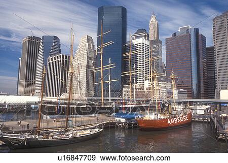 Stock Photo -  Manhattan, New York City, New York, N. Y. C Skyline of Lower Manhattan and South Street Seaport Museum on the East River in New York City, New York.. Fotosearch