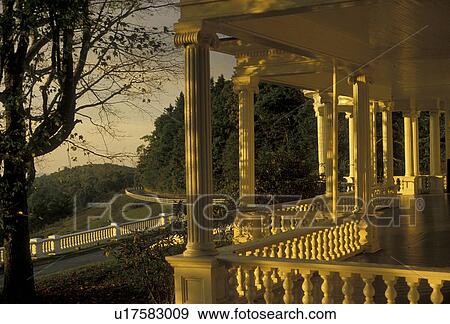 mansion, Blue Ridge Parkway, Moses H. Cone Memorial Park, North Carolina, Golden sunlight shines on the white columns of the porch of the mansion at Moses H. Cone Memorial Park. View Large Photo Image Stock Photo - mansion, Blue Ridge Parkway, Moses H. Cone Memorial Park, North Carolina, Golden sunlight shines on the white columns of the porch of the mansion at Moses H. Cone Memorial Park.. Fotosearch