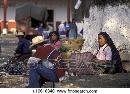 Stock Image -  market, Indian, Mexico, Patzcuaro, Tarasco Indian women displaying their wares on market day in the city of Patzcuaro in the state of Michoacan.. Fotosearch