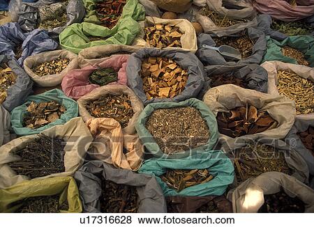 Stock Photo -  market, spices, Mexico, Jocotepec, Grains, spices, and roots are displayed at an open air market in Jocotepec in the state of Jalisco.. Fotosearch