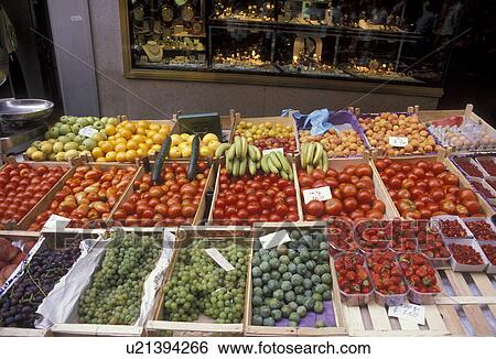 Stock Photograph -  market, Switzerland, Lausanne, Vaud, Europe, Fresh fruits and vegetables are displayed in crates at a produce stand in the city of Lausanne on market day in the Canton of Vaud.. Fotosearch