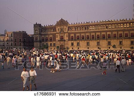 Mexico City, Mexico, National Palace, Plaza Zocalo, People walking in the Plaza Zocalo in front of the National Palace (Palacio Nacional) in Mexico City in the state of Distrito Federal. View Large Photo Image Stock Image - Mexico City, Mexico, National Palace, Plaza Zocalo, People walking in the Plaza Zocalo in front of the National Palace (Palacio Nacional) in Mexico City in the state of Distrito Federal.. Fotosearch