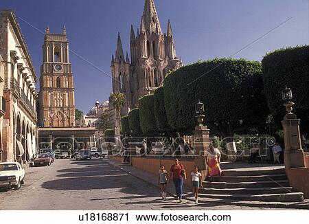 Stock Image -  Mexico, San Miguel de Allende, View of the Central Plaza and Parich Church (La Parroquia) in San Miguel de Allende in the state of Guanajuato . Fotosearch
