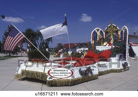 Stock Image -  Michigan, Frankenmuth, Flags fly on The Advent Wreath Float displayed at Bronner's Christmas Wonderland in Frankenmuth . Fotosearch