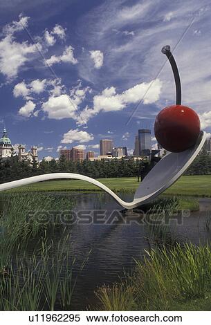 Stock Photography -  Minneapolis, Twin Cities, cherry, spoon, Minnesota, Spoonbridge and Cherry Sculpture in the Minneapolis Sculpture Garden at the Walker Art Center with the skyline of downtown Minneapolis in the state of Minnesota.. Fotosearch