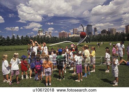 Minneapolis, Twin Cities, Minnesota, Students and teachers on a field trip in front of the Spoonbridge and Cherry Sculpture at the Minneapolis Sculpture Garden at the Walker Art Center in Minneapolis in the state of Minnesota. View Large Photo Image Stock Photo - Minneapolis, Twin Cities, Minnesota, Students and teachers on a field trip in front of the Spoonbridge and Cherry Sculpture at the Minneapolis Sculpture Garden at the Walker Art Center in Minneapolis in the state of Minnesota.. Fotosearch