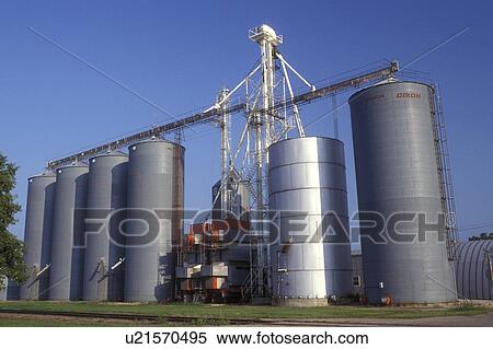 Stock Photography -  Minnesota, A huge grain elevator stands along side the railroad tracks in Sherburn.. Fotosearch