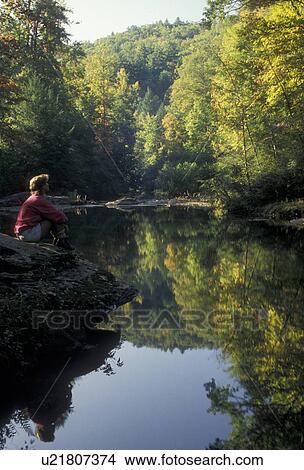 mirror, reflection, North Georgia, Appalachian Mountains, A woman sits by the edge of the Tallulah River looking at the reflection of the trees in the calm water in the state of Georgia. View Large Photo Image Picture - mirror, reflection, North Georgia, Appalachian Mountains, A woman sits by the edge of the Tallulah River looking at the reflection of the trees in the calm water in the state of Georgia.. Fotosearch