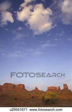 Stock Image -  Monument Valley, Monument Valley Navajo Tribal Park, Navajo Reservation, Utah, Arizona, Scenic view of the secluded dry land and isolated monoliths of Monument Valley Navajo Tribal Park in the state of Utah. . Fotosearch