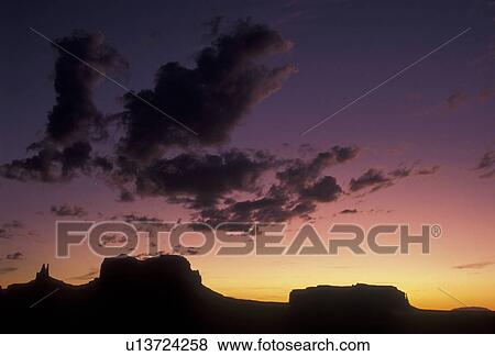 Monument Valley, silhouette, Monument Valley Navajo Tribal Park, Navajo Reservation, Utah, Arizona, Sunset over Monument Valley Navajo Tribal Park in the state of Utah. View Large Photo Image Stock Photo - Monument Valley, silhouette, Monument Valley Navajo Tribal Park, Navajo Reservation, Utah, Arizona, Sunset over Monument Valley Navajo Tribal Park in the state of Utah. . Fotosearch