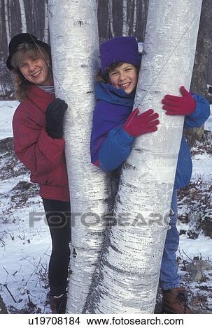 mother & daughter, Vermont, birch tree, Mother and 10 year old daughter pose for picture holding onto the white trunk of a birch tree in Groton State Forest in Caledonia County in the state of Vermont. View Large Photo Image Picture - mother & daughter, Vermont, birch tree, Mother and 10 year old daughter pose for picture holding onto the white trunk of a birch tree in Groton State Forest in Caledonia County in the state of Vermont.. Fotosearch