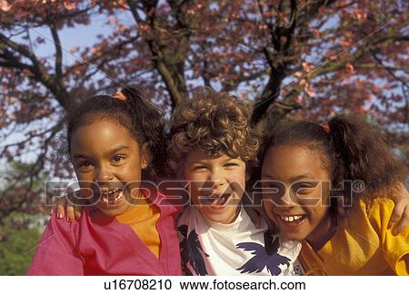 multi-ethnic, friendship, pals, Two (black, African-American) girls and one (white, Caucasian) girl with arms around each other laughing together on a warm spring day in Exton in the state of Pennsylvania. View Large Photo Image Stock Image - multi-ethnic, friendship, pals, Two (black, African-American) girls and one (white, Caucasian) girl with arms around each other laughing together on a warm spring day in Exton in the state of Pennsylvania.. Fotosearch