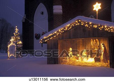 nativity scene, Christmas, winter, snow, church, X-mas, xmas, Vermont, An illuminated snow covered nativity scene decorates the grounds of St. Thomas church in Underhill Center in Chittenden County in the state of Vermont. View Large Photo Image Stock Photograph - nativity scene, Christmas, winter, snow, church, X-mas, xmas, Vermont, An illuminated snow covered nativity scene decorates the grounds of St. Thomas church in Underhill Center in Chittenden County in the state of Vermont. . Fotosearch