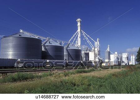 Nebraska, Loading train cars with grain from grain elevator in Brule. View Large Photo Image Stock Photo - Nebraska, Loading train cars with grain from grain elevator in Brule.. Fotosearch