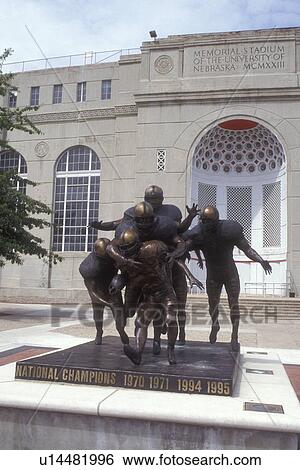 Stock Photograph -  Nebraska, NCAA, Football statue in front of Memorial Stadium at the University of Nebraska in Lincoln . Fotosearch