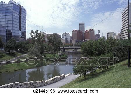 Stock Photograph -  Nebraska, Skyline of downtown Omaha from the Gene Leahy Mall.. Fotosearch