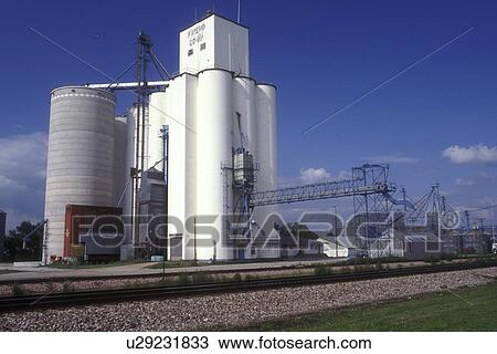 Nebraska, White grain elevator next to railroad tracks in Friend. View Large Photo Image Stock Image - Nebraska, White grain elevator next to railroad tracks in Friend.. Fotosearch