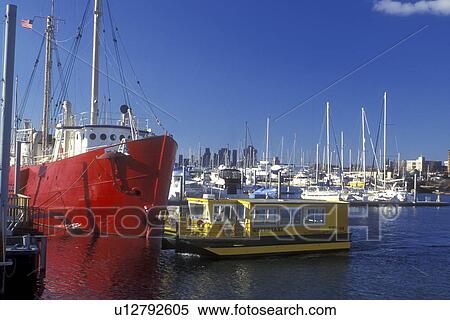 New Jersey, Jersey City, Liberty State Park, A yellow water taxi leaves the dock on Upper New York Bay transporting passengers to Manhattan, New York. A red craft is docked in background. View Large Photo Image Stock Photography - New Jersey, Jersey City, Liberty State Park, A yellow water taxi leaves the dock on Upper New York Bay transporting passengers to Manhattan, New York. A red craft is docked in background.. Fotosearch