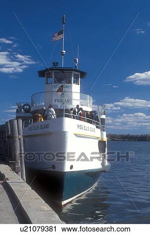 Stock Image -  New York City, Battery Park, New York, Lower Manhattan, Ferry, N. Y. C Statue of Liberty Passenger Ferry departing from pier at Battery Park in New York Harbor in New York City, New York. . Fotosearch