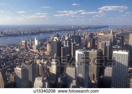 Stock Photo -  New York City, Manhattan, New York, N. Y. C Aerial view of New York City, New York looking northwest towards Midtown Manhattan and East River (Hudson River) from the Empire State Building.. Fotosearch