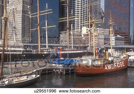New York City, Manhattan, New York, N. Y. C boat, Skyline of Lower Manhattan and South Street Seaport on the East River in New York City, New York. Clipper ships moored at the piers. View Large Photo Image Stock Photograph - New York City, Manhattan, New York, N. Y. C boat, Skyline of Lower Manhattan and South Street Seaport on the East River in New York City, New York. Clipper ships moored at the piers.. Fotosearch