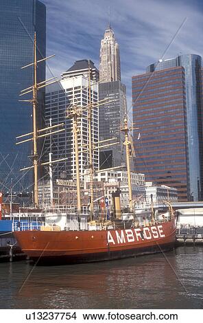 New York City, Manhattan, New York, boat, N. Y. C Skyline of Lower Manhattan and South Street Seaport Museum on the East River In New York City, New York. The red 1908 Ambrose vessel moored at the pier. View Large Photo Image Picture - New York City, Manhattan, New York, boat, N. Y. C Skyline of Lower Manhattan and South Street Seaport Museum on the East River In New York City, New York. The red 1908 Ambrose vessel moored at the pier.. Fotosearch