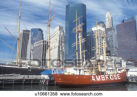New York City, Manhattan, skyline, New York, N. Y. C Skyline of Lower Manhattan and South Street Seaport Museum on the East River in New York City, New York. Sailing vessel moored at the pier. View Large Photo Image Stock Photo - New York City, Manhattan, skyline, New York, N. Y. C Skyline of Lower Manhattan and South Street Seaport Museum on the East River in New York City, New York. Sailing vessel moored at the pier.. Fotosearch