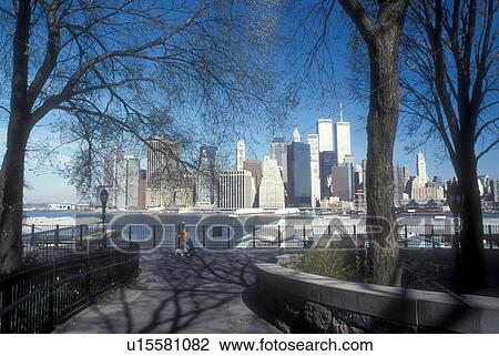 Stock Image -  New York City, New York, skyline, Manhattan, N. Y. C Skyline of downtown Manhattan from the Esplande in Brooklyn Heights on the East River in New York City, New York.. Fotosearch