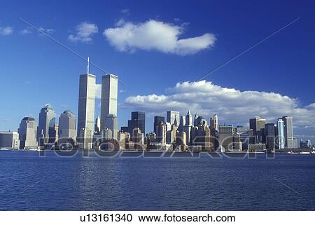 New York City, New York, The skyline of Manhattan reflects in the waters of New York Harbor View Large Photo Image Stock Image - New York City, New York, The skyline of Manhattan reflects in the waters of New York Harbor . Fotosearch