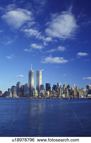 New York City, New York, The skyline of downtown Manhattan reflects in the waters of New York Harbor View Large Photo Image Stock Photograph - New York City, New York, The skyline of downtown Manhattan reflects in the waters of New York Harbor . Fotosearch