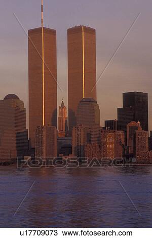 New York City, New York, World Trade Center, Manhattan, The skyline of Manhattan reflects in the waters of New York Harbor at sunset. View Large Photo Image Stock Image - New York City, New York, World Trade Center, Manhattan, The skyline of Manhattan reflects in the waters of New York Harbor at sunset.. Fotosearch