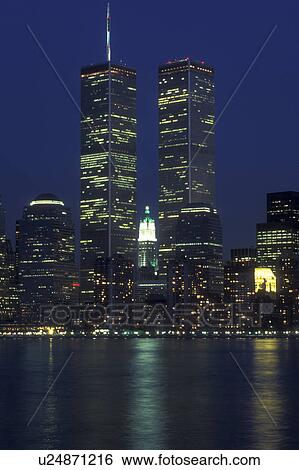 New York City, New York, World Trade Center, The illuminated skyline of Manhattan reflects in the waters of New York Harbor at night (evening). View Large Photo Image Stock Photograph - New York City, New York, World Trade Center, The illuminated skyline of Manhattan reflects in the waters of New York Harbor at night (evening).. Fotosearch