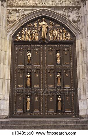 Stock Image -  New York City, Saint Patrick's Cathedral, Manhattan, church, New York, NYC, N. Y. C The ornate front doors of St. Patrick's Cathedral in Midtown Manhattan in New York City in the state of New York.. Fotosearch