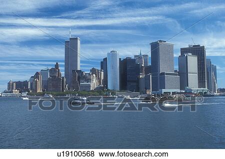 Stock Photo -  New York City, skyline, Manhattan, New York, N. Y. C Manhattan skyline from the Staten Island Ferry in New York Harbor in New York City, New York.. Fotosearch