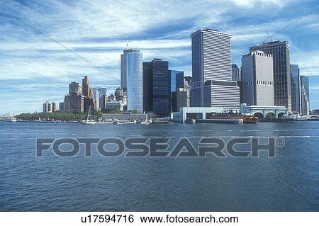 Stock Photograph -  New York City, skyline, Manhattan, New York, N. Y. C Manhattan skyline from the Staten Island Ferry in New York Harbor in New York City, New York.. Fotosearch
