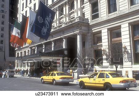 New York City, The Plaza Hotel, Manhattan, New York, N. Y. C NYC, Yellow taxis parked in front of The Plaza Hotel built in 1907 in Midtown Manhattan in New York City, New York. Flags hang in front of the hotel. View Large Photo Image Stock Image - New York City, The Plaza Hotel, Manhattan, New York, N. Y. C NYC, Yellow taxis parked in front of The Plaza Hotel built in 1907 in Midtown Manhattan in New York City, New York. Flags hang in front of the hotel.. Fotosearch