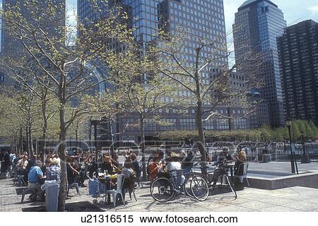 New York City, World Financial Center, New York, Battery Park City, Manhattan, N. Y. C People sitting at an outdoor cafe at The World Financial Center on a spring day in New York City, New York. View Large Photo Image Stock Photography -  New York City, World Financial Center, New York, Battery Park City, Manhattan, N. Y. C People sitting at an outdoor cafe at The World Financial Center on a spring day in New York City, New York.. Fotosearch