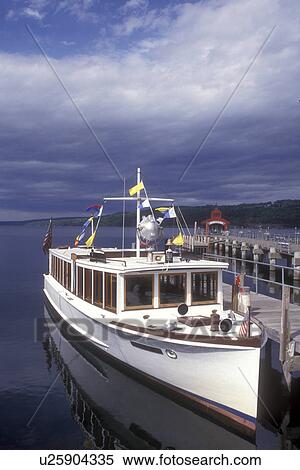 Stock Photography -  New York, Finger Lakes, Captain Bill's Seneca Lake Cruise, the Stroller IV, sightseeing boat docked at marina on Seneca Lake in Watkins Glen. . Fotosearch