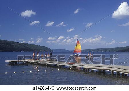 New York, Finger Lakes, Swimming and sailing on Keuka Lake in Hammondsport View Large Photo Image Stock Photograph - New York, Finger Lakes, Swimming and sailing on Keuka Lake in Hammondsport . Fotosearch