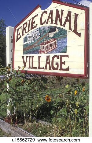 Stock Photo -  New York, Rome, Entrance sign to the Erie Canal Village. An 1840 restored community . Fotosearch